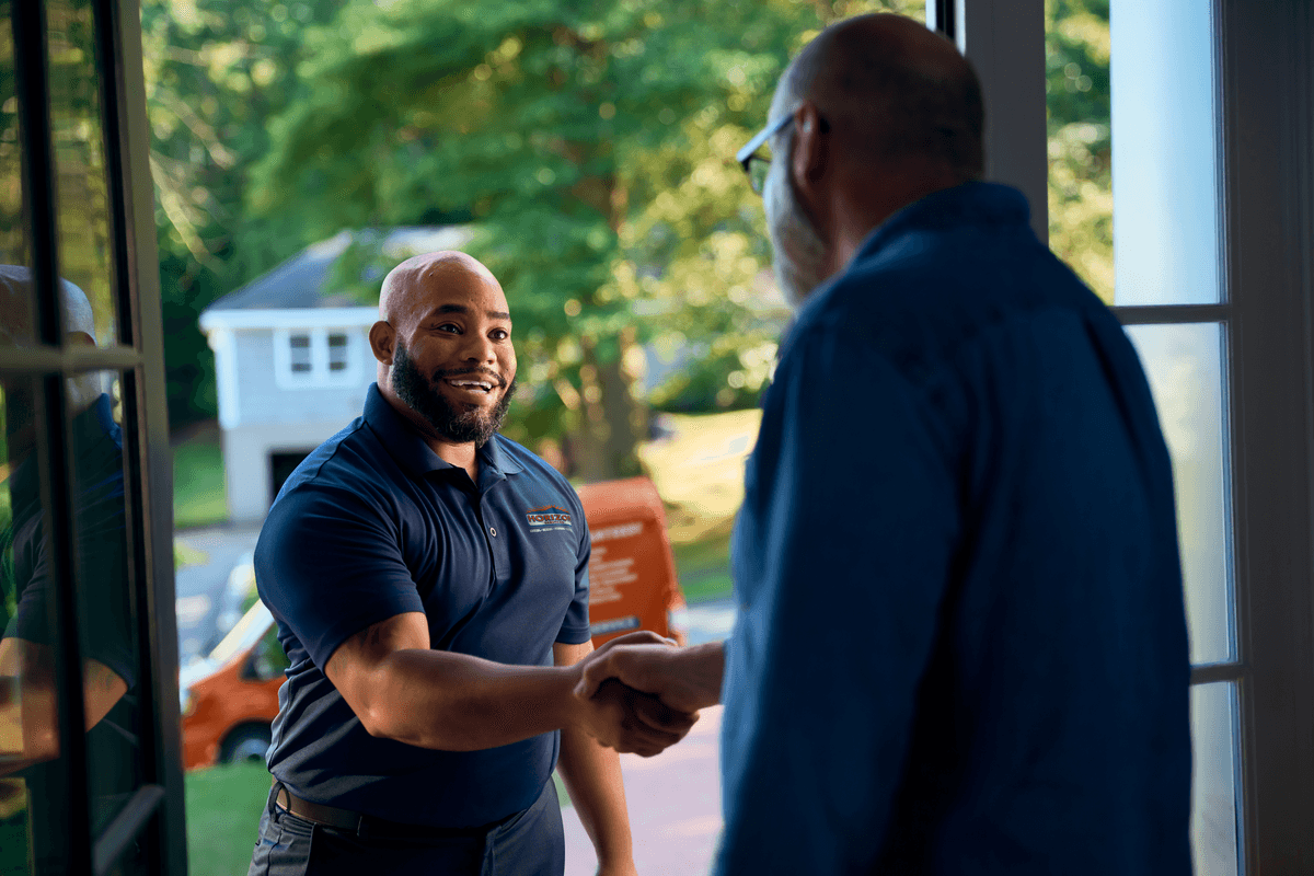 Technician shaking customers hand